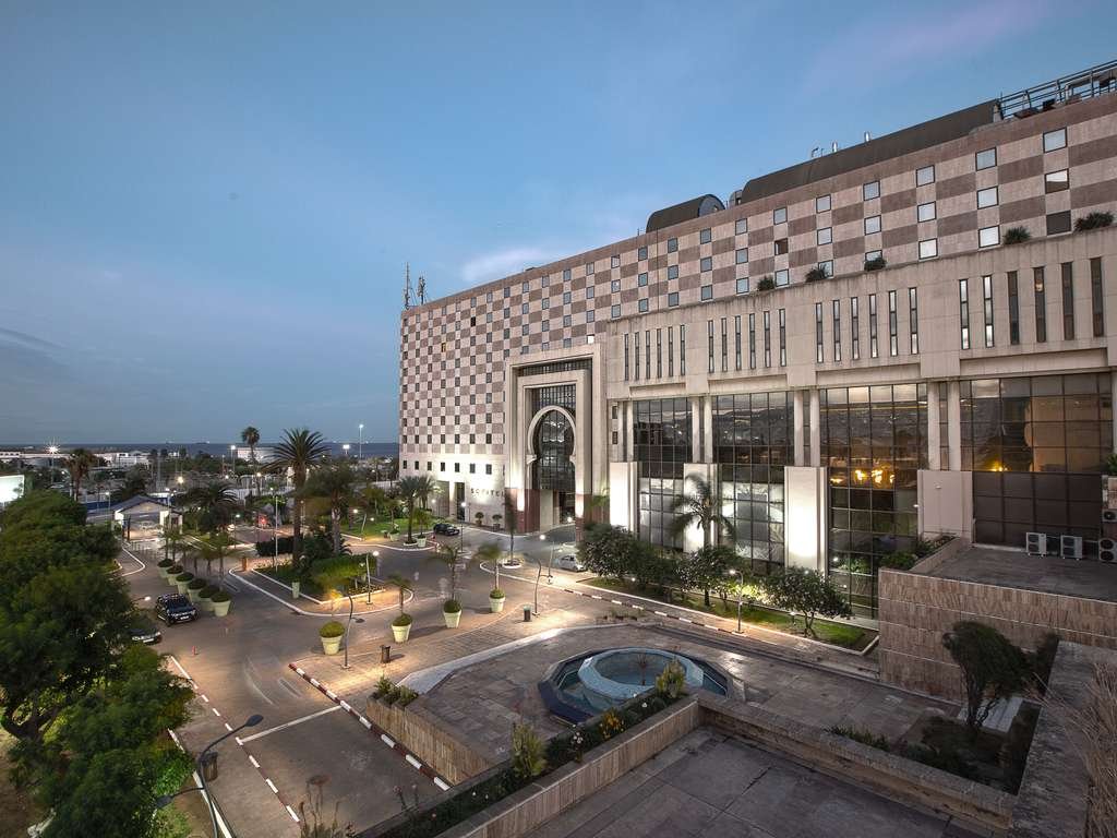 Sofitel Algiers Hamma Garden hotel and its landscaped forecourt at dusk