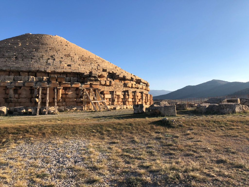 Medracen-style Numidian royal mausoleum at El Khroub, a stepped stone tomb on open grassland