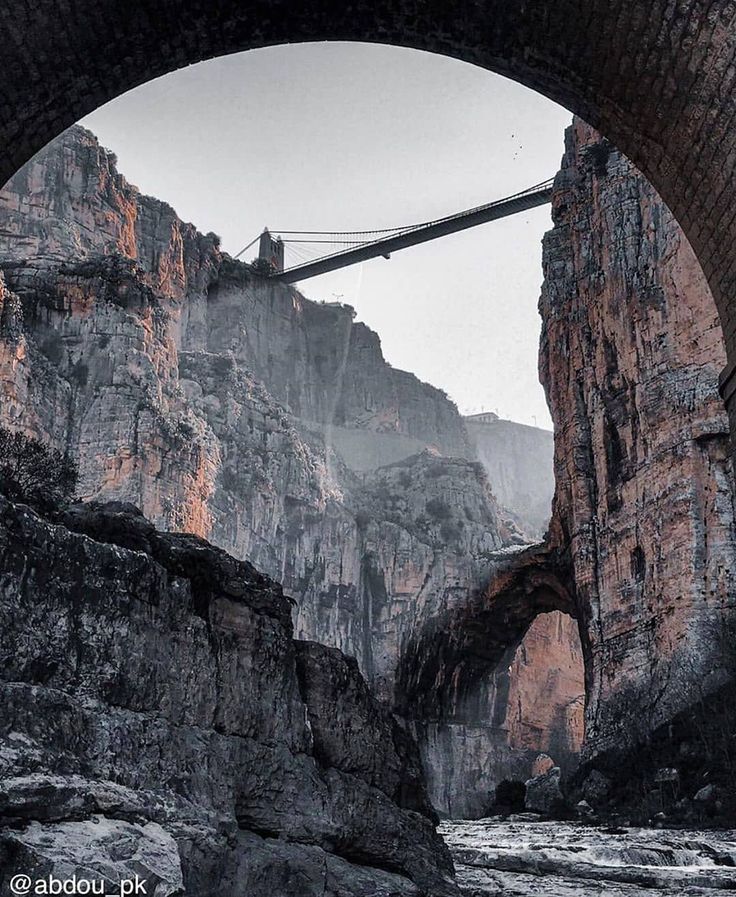 Sidi M'Cid bridge seen through a stone arch at the bottom of the Rhumel gorge