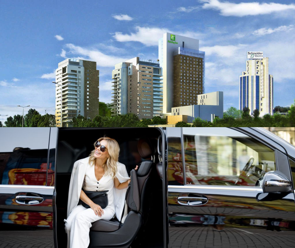 Woman stepping out of a black minivan taxi in front of city towers