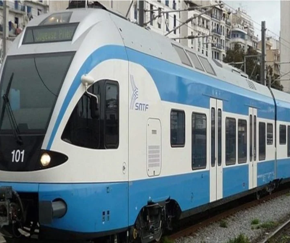 Blue and white SNTF intercity train at a station
