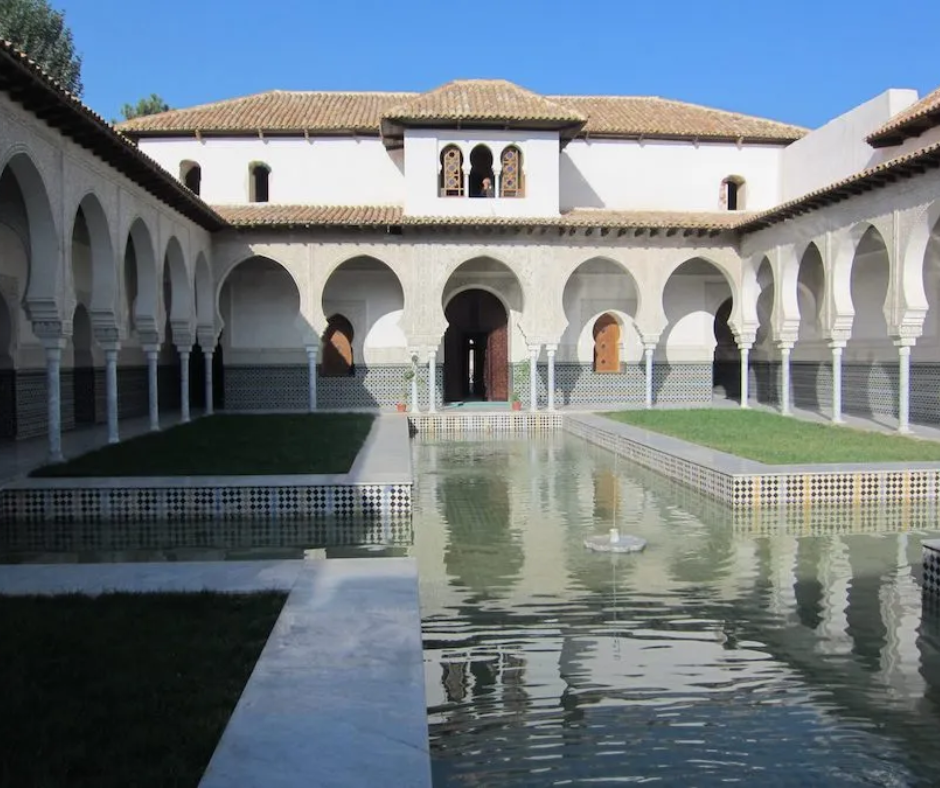 Courtyard with a reflecting pool and horseshoe arches at the Mechouar Palace in Tlemcen