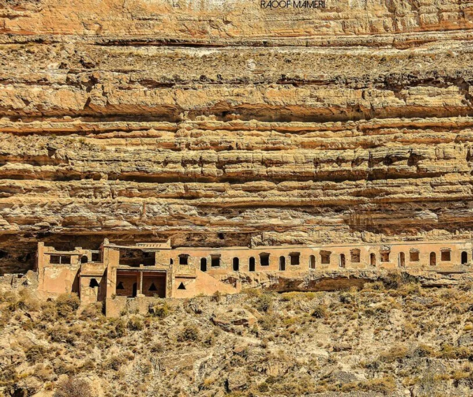 Ghoufi's old cliff-edge dwellings built into layered rock