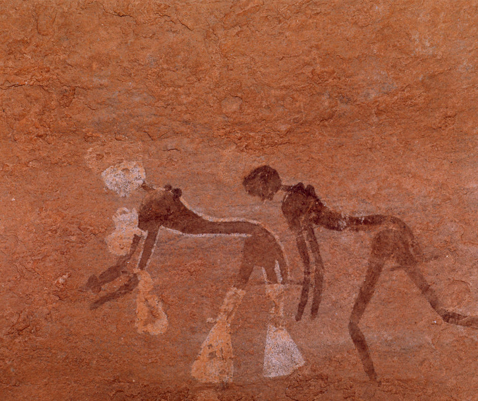 Ancient rock painting of two bending figures with round heads in Tassili n'Ajjer