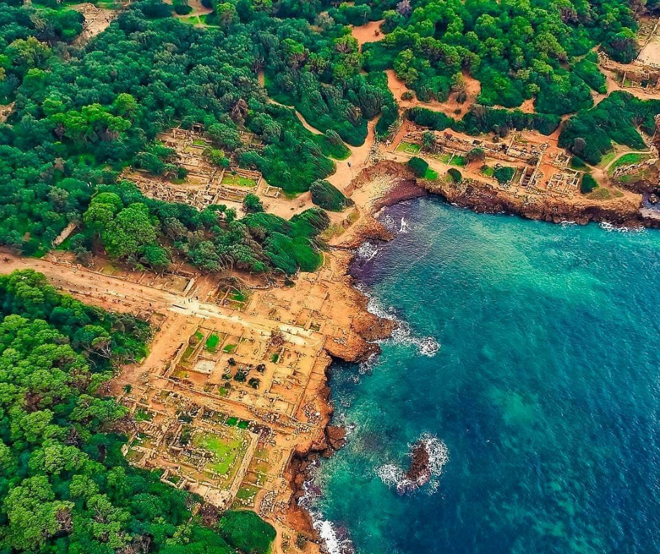 Aerial view of Roman ruins by the turquoise sea at Tipaza